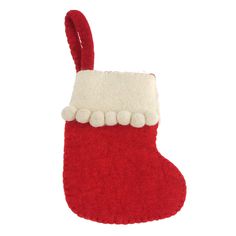 a red and white stocking with pom - poms hanging from it's side