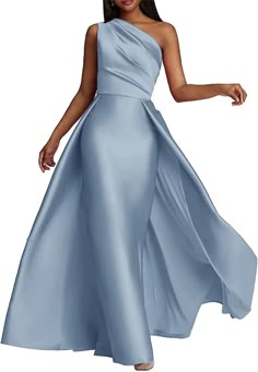 a woman in a long blue dress with one shoulder and flowing fabric on the skirt