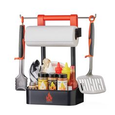 an orange and black grilling rack with utensils