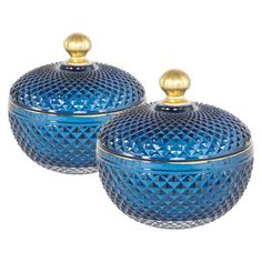 two blue glass covered dishes with gold accents