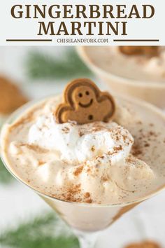 two glasses filled with gingerbread martini and topped with whipped cream, cinnamon grahams