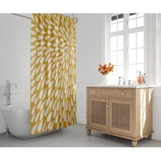 a bathroom with a yellow shower curtain next to a sink