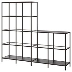 two black shelves with glass shelves on each side and one shelf below them, against a white background