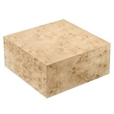 a square wooden box sitting on top of a white floor