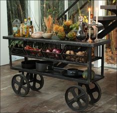 a cart with food on it sitting in front of a window