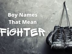 two boxing gloves hanging on a wall with the words, boy names that mean fighter