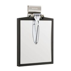 a white and black clipboard with a pen on it's back end, attached to the wall