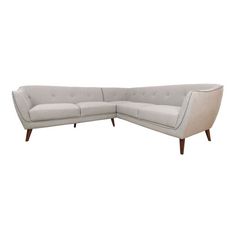 a white sectional couch sitting on top of a wooden frame