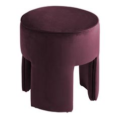 a purple velvet stool with two legs