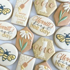 decorated cookies are arranged in the shape of honeybees and beehive with words on them