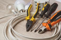 various electrical tools are laid out on a table