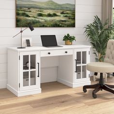 a white desk with a laptop on it and a chair in front of the desk