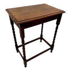 a small wooden table with turned legs and a square top on one end, against a white background