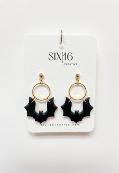 the bat earrings are black and gold