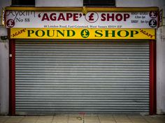 an empty store front with the door closed