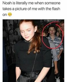 a woman with red hair is looking at her cell phone and has the caption'noah is literally me when someone takes pictures of me with the flash on