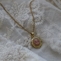 Dainty Pink Cameo Necklace, Coquette Aesthetic Necklace, Gold Layering Necklace, Pink Jewelry for Her, Vintage Necklace, Victorian Jewelry ☽ 24K Gold Plated Charm (25.4x14.9mm) ☽ This is a gold plated charm meaning that it requires extra care to keep its shine and color intact. Please follow these tips to make the charm last longer in its original condition: avoid wearing it to the beach, pool, shower, bathtub, hot tub; avoid it touching any lotions, creams, or sweat; take it off before going to Dark Academia Accessories, Dark Academia Jewelry, Necklace Coquette, Summer Core, Aesthetic Necklace, Vintage Necklaces, Cameo Necklace, Pink Jewelry, Jewelry Lookbook