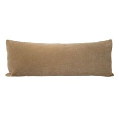 a brown pillow on a white background