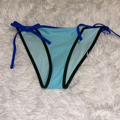 Sexy Beautiful Blue Swimwear With Tie-side Bottom For Beach Party, Blue Brief Swimwear For Beach Party, Blue Tie-side Bottoms For Beach Party, Blue Party Bottoms For Beach Season, Blue Tie-side Bottom Swimwear For Beach, Beachy Blue Tie-side Swimwear Bottom, Beachy Blue Tie-side Swim Bottoms, Beachy Blue Tie-side Swimwear, Blue Tie-side Bottoms For Sunbathing