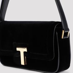 Tom Ford Wallis Black Velvet Shoulder Bag. Crafted in black velvet, golden-toned hardware, front flap, T metal closure with engraved logo, adjustable shoulder strap, one compartment, one inner pocket, leather lining. Tom Ford Bag, Best Caps, Leather Cap, Boot Pumps, Engraved Logo, Shoulder Handbag, Small Handbags, Tory Burch Shoes, Mens Shoes Sneakers