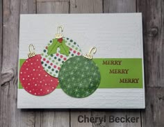 a christmas card with three ornaments on it