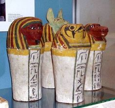 three candy bars sitting on top of a counter next to each other in plastic cups