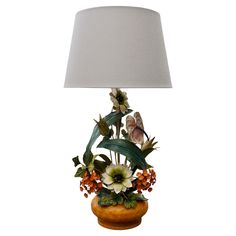 a table lamp with flowers and butterflies on it