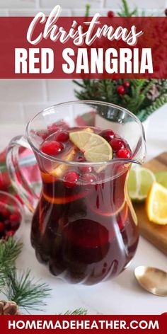 a glass pitcher filled with cranberry christmas red sangria