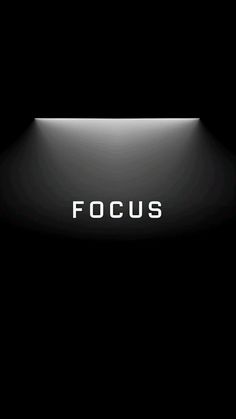 the word focus is lit up on a black background with light coming from behind it