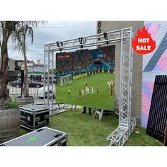 an outdoor soccer field is set up for a sporting event with people watching from the stands