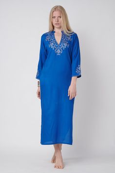 this ocean blue gallabia dress embroided in silver cord is the summer beach look with small sleeves and open 27 cm v neck sexy and suitable for summer 125 cm length embroidery over the v neck, sleeves and back - great look! Blue V-neck Dress With Resham Embroidery, Elegant Kaftan With Chikankari Embroidery And V-neck, Elegant V-neck Kaftan With Chikankari Embroidery, Traditional V-neck Dress With Embroidered Neckline, V-neck Kaftan With Embroidered Neckline For Festive, Festive V-neck Kaftan With Embroidered Neckline, Blue Long Sleeve V-neck Dress For Vacation, Blue Kurta With Embroidered Neckline For Spring, Festive V-neck Kaftan