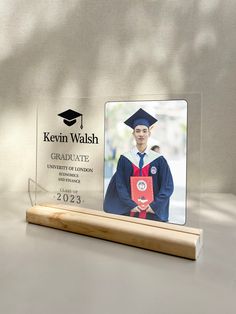 a glass plaque with a graduation photo on it