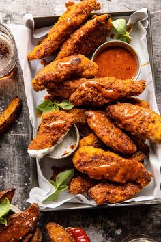 fried chicken wings with dipping sauce on a tray