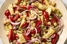 a bowl filled with vegetables and chickpeas