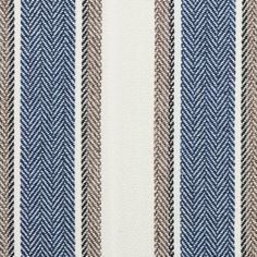 an upholstered striped fabric with brown and blue stripes on the outside of it