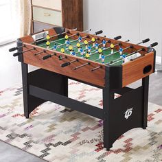 a foosball table sitting on top of a rug