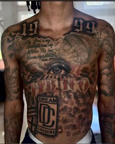 a man with many tattoos on his chest