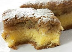 a close up of a piece of cake on a plate with powdered sugar topping