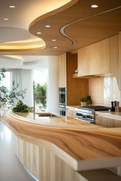 a modern kitchen with wooden counter tops and white walls, along with potted plants