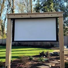 a large screen in the middle of a yard