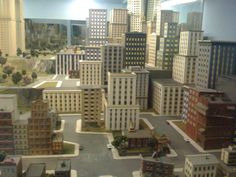 a model city is shown with buildings and roads