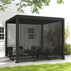 a black metal fence next to a white house