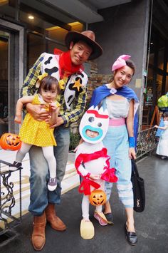 a man and two children are dressed up for halloween