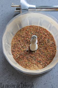 a blender filled with spices on top of a table