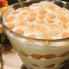 a large glass dish filled with white and orange dessert