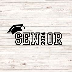 the word senior on top of a wooden background with graduation cap and tassels