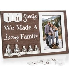 a family picture frame with the words 10 years we made a loving family