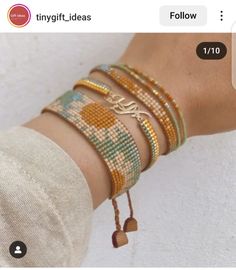 the bracelets are all different colors and designs on each wrist, but one is gold