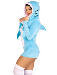 a woman in a blue shark costume posing for the camera with her hands on her hips