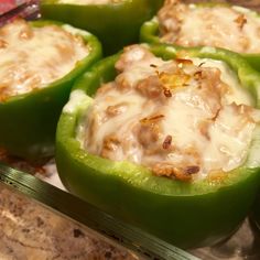 some green peppers with cheese on them and a fork next to it, ready to be eaten